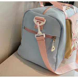 Chic pastel colorblock travel duffel bag with durable straps and spacious storage capacity.