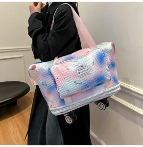 Stylish gradient travel duffel bag with wheels and large capacity for women travel use.