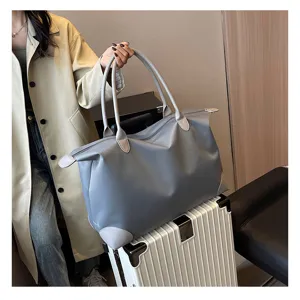 Large capacity travel duffel bag for women, lightweight waterproof carry-on flight luggage.
