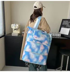 Expandable rolling travel tote bag with cosmic gradient print and universal wheels.