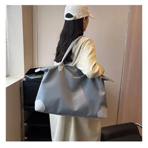 Large capacity travel duffel bag for women, lightweight casual weekender bag with top handles.