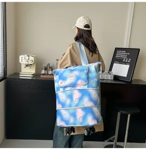 Expandable travel tote bag with universal wheels and galaxy print, detail view of large capacity.