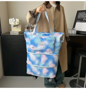 Large capacity expandable travel rolling tote bag with universal wheels for women fashion style.