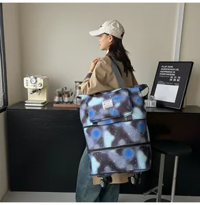 Large capacity expandable travel rolling tote bag with universal wheels and stylish print.