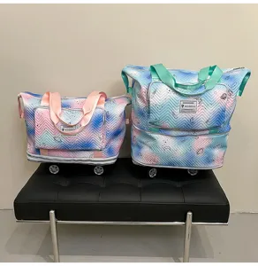 Expandable rolling travel tote bag with universal wheels, stylish space print, large capacity.