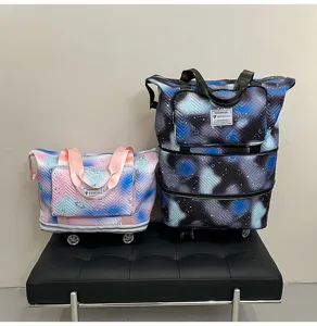 Large capacity expandable travel duffel bag with universal wheels and stylish galaxy print.