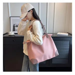 Large capacity lightweight travel tote bag, pink nylon shoulder luggage bag for short trips.