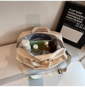 Versatile beige travel duffel bag with large capacity, durable fabric, and crossbody strap.