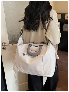 Spacious casual travel duffel bag for women, lightweight commuter shoulder bag for gym.