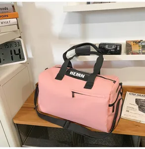 Large capacity pink gym duffel bag for sports, travel, and outdoor fitness storage use.