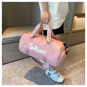 Large capacity travel duffel bag for gym, sports, and business trips with shoulder strap.