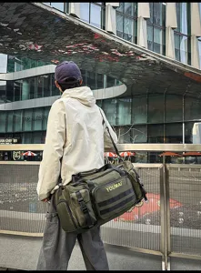Outdoor travel duffel bag detail view, multi-pocket tactical design, urban commuting.