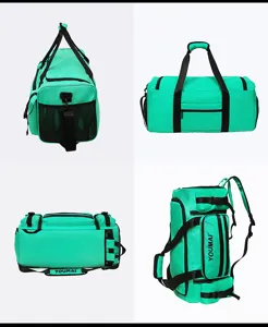 Green travel duffel backpack detail showing multiple pockets, sturdy straps and durable zippers.