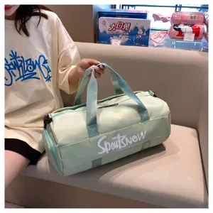 Large capacity green travel duffel bag detail showing durable straps and stylish print.