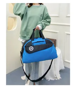 Blue and black travel duffel bag with adjustable shoulder strap and front zipper pocket.