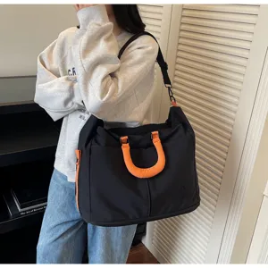 Large capacity travel duffel bag with orange handles, stylish fitness gym bag for daily commute.