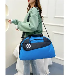 Detailed shot of casual blue black travel duffel bag worn by model, convenient storage.