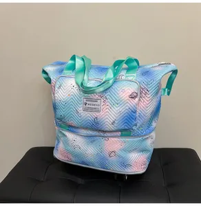 Expandable travel tote bag with universal wheels and space print for business trips