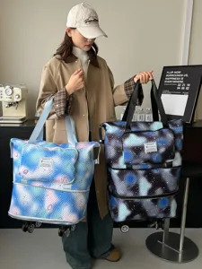 Travel rolling tote bag for women, large capacity expandable luggage bag with wheels.