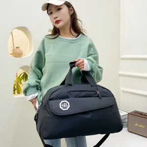 Casual travel duffel bag for women, foldable luggage storage bag with handle and shoulder strap.