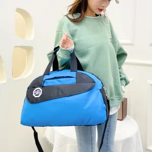 Large capacity foldable travel duffel bag with shoulder strap for outdoor sports and business trips.