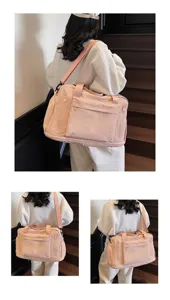 Stylish pink large capacity fitness travel duffel bag with crossbody strap for sports yoga trips.