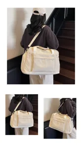 Large capacity canvas travel fitness gym bag detail, versatile crossbody shoulder strap design.