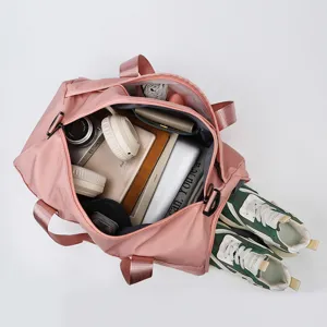 Large capacity travel duffel bag for gym, sports, and business trips with multiple compartments.