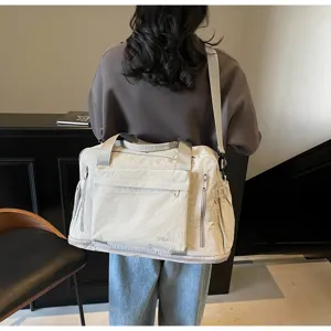 Detail view of the large capacity travel gym bag, showing strap and multi-pocket design.