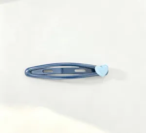 Blue snap hair clip with cute heart charm, ideal for styling bangs and daily hair accessories.