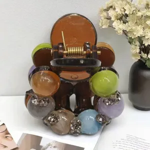 Detail of Korean style bead hair claw clip, featuring colorful spheres and decorative crystals.