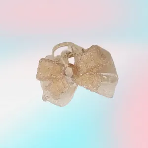 Charming small bow hair claw clip with sparkling rhinestones, stylish side hair accessory for women.