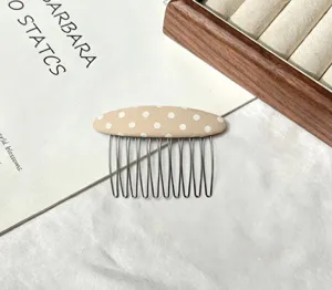 Fabric polka dot hair insert comb, stylish non-slip hair styling accessory for daily wear.
