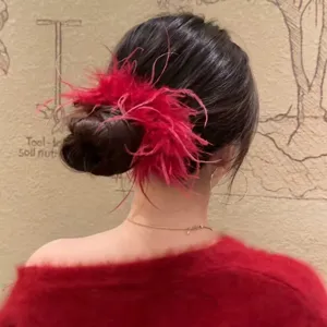 Red ostrich feather hair claw clip for women, fluffy large hair accessory for elegant updo styling.