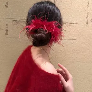 Large ostrich feather hair claw clip for women, winter fluffy hair accessory back head styling.