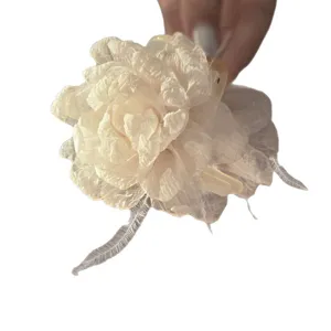 Sweet mesh flower hair claw clip with feather design, elegant shark clip for women and girls.