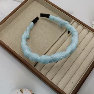 Stylish light blue braided headband for women, trendy hair accessories for daily wear and travel.
