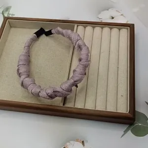 Elegant pleated fabric headband with teeth for women, stylish mauve hair hoop for daily wear.