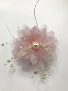 Pink floral claw clip with pearls and feathers, stylish hair accessory for women.