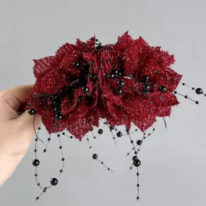 Red flower hair claw clip detail shot featuring elegant black beaded dangling tassels.