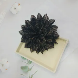 Dark multi-layered fabric flower accessory, elegant dark glitter floral design for versatile styling.