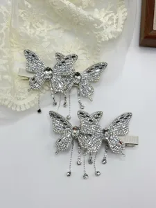 Stunning butterfly hair clip with sparkling rhinestones and delicate tassel charms for women.