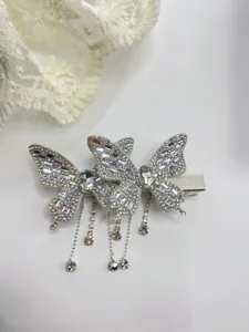 Exquisite crystal butterfly hair clip with dazzling rhinestone fringe details, perfect for elegant styles.