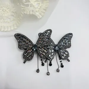 Elegant black crystal rhinestone butterfly hair clip with delicate beaded tassel dangles