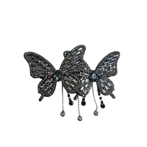 Elegant black rhinestone butterfly hair clip with dazzling fringe tassels for women.