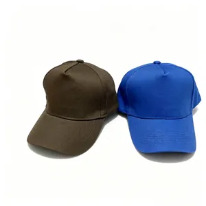 Detailed view of plain cotton baseball caps in brown and blue colors, simple hard-top design.