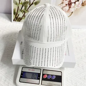 White satin baseball cap featuring sparkling rhinestone meteor shower details for stylish sun protection.