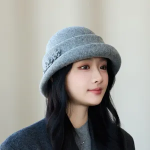 Detailed view of a elegant grey wool felt bucket hat featuring delicate floral and rhinestone decor.