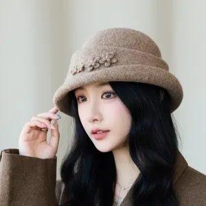 Stylish woolen bucket hat for women, elegant floral decor, warm autumn winter headwear.