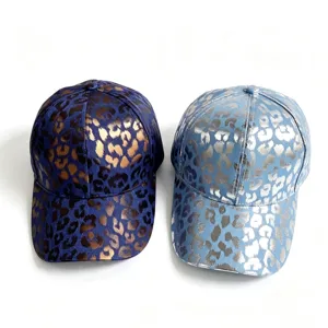 Detailed view of the stylish leopard print denim baseball cap, showcasing metallic bronzing.